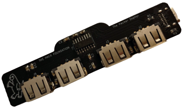 A rectangular circuit board in the shape of a train car that acts as a USB type C hub.